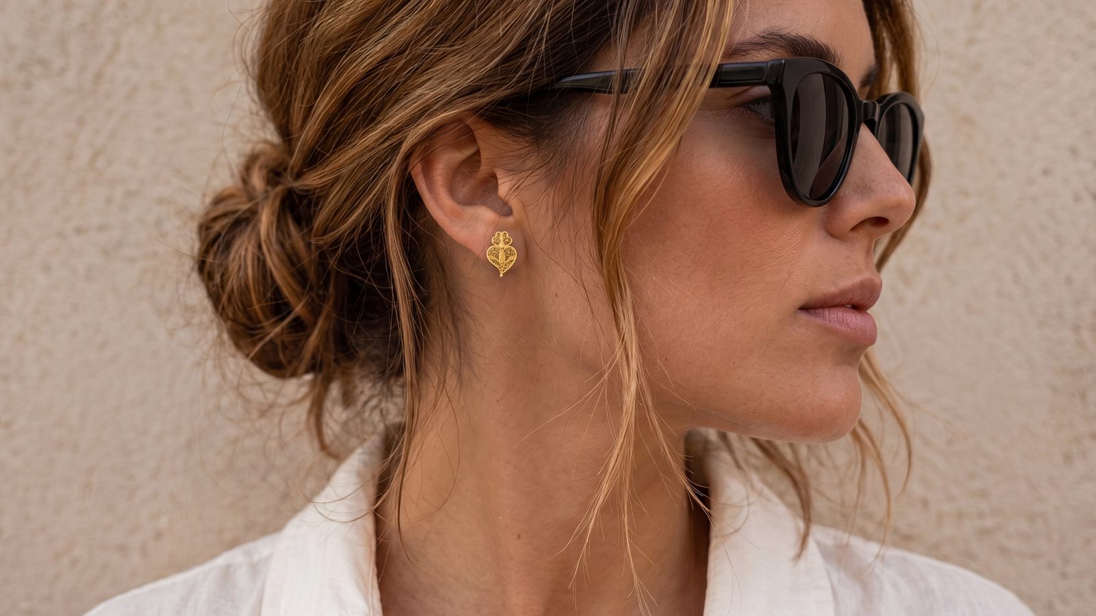 Heart of Viana stud earrings worn with a white linen shirt